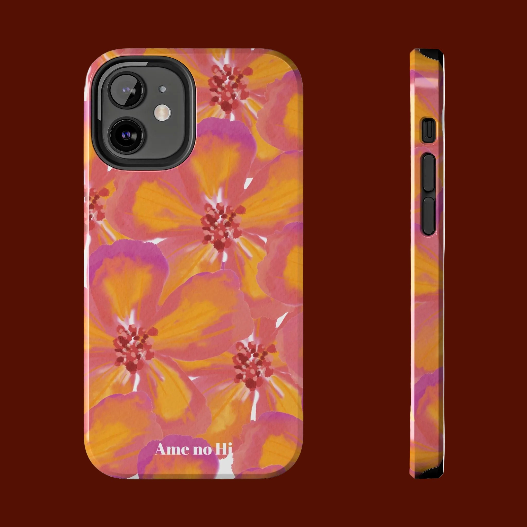 Phone case with pink and orange floral design on a white background